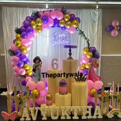 For a truly royal celebration, my Princess theme is always a favorite. This setup for a 6th birthday features a beautiful balloon arch in purple and pink, cutouts of famous princesses like Jasmine and Aurora, and elegant gold accents.