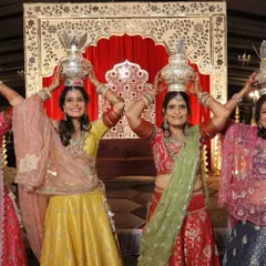 A beautiful moment from a Mayra ceremony, with the women of the family celebrating in our custom-designed lehengas. We created a unique color story for each person, from bright yellow to festive red, to reflect their individual personalities.