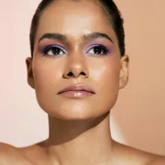 A stunning final shot of the lilac eyeshadow look. The color is packed on for intensity but blended at the edges for a soft, diffused finish.