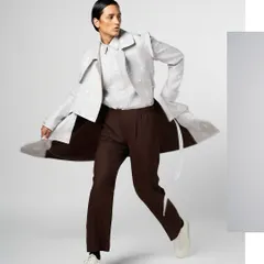 Another dynamic shot for Line Outline, showcasing a clean yet strong grooming look. The focus is on defined features and flawless skin to complement the avant-garde clothing.
