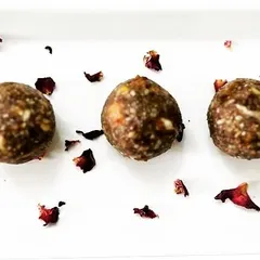 This is my protein laddu, a perfect post-workout snack. It's made with a powerful blend of peanuts, sesame, dates, and a mix of super seeds to refuel your body naturally.