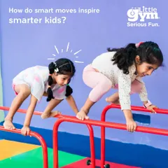 Two girls work on their balance and coordination as they navigate the parallel bars. These smart moves inspire smarter kids, fostering problem-solving skills and self-awareness.