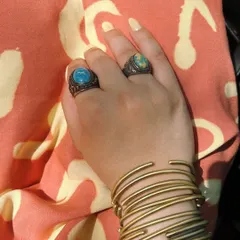 Accessories are a key part of my personal style. Here is a detail shot of some of my favorite statement rings and a stack of brass bangles, perfect for adding a boho touch to a summer look.