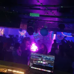 My laptop in the foreground, the packed dance floor in the back. This is my command center for controlling the night's energy.