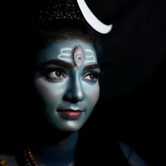 This is my artistic tribute to Lord Shiva, created using professional body paint and dramatic lighting. The look focuses on capturing a divine essence, complete with the iconic third eye and crescent moon, perfect for mythological photoshoots or themed events.