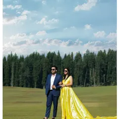 A stylish pose against the backdrop of Kashmir's endless pine forests and a dramatic sky. This shot showcases how we can create a high-fashion look even in the midst of nature, blending elegance with the raw beauty of the mountains.