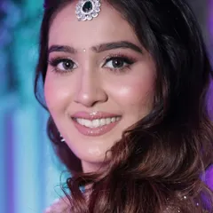 This portrait captures the fresh and radiant feel of the makeup, which is designed to look beautiful both in person and on camera.