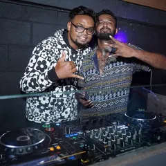 With an MC at a "Major Flava Friday" event. I can arrange for an MC to host your party, engage the crowd, and take your event to the next level.