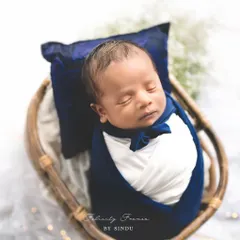 Dressed in his little best. This handsome newborn looks so dapper, swaddled in deep blue with a tiny bow tie. It’s these sweet details that make each newborn session unique.