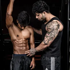 A moment from a photoshoot prep where I'm checking my client's conditioning. Constant monitoring is key to ensuring we peak at the right time.
