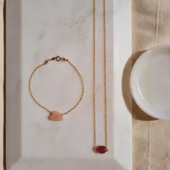 To attract more money, wear Ruby. This image shows my 'ámya' Ruby Baati choker alongside a Peach Moonstone cloud bracelet for luck and abundance.