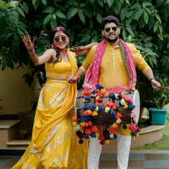The energy of a Haldi ceremony is contagious! We love seeing our couples, like Sukriti and Rahul, have the time of their lives, complete with dhol players and colorful decor that matches their joyful spirit.