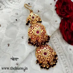 The 'बेला' (Bela) gold-plated Jadau Mangtika. This restocked piece features a grand, three-tiered design with rich maroon beads.