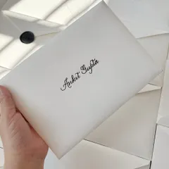The finishing touches for the Adidas project. Each personalized certificate was enclosed in a subtly textured white envelope, carefully addressed with a brush pen, and sealed with a dark grey custom Adidas wax seal.