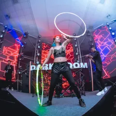On stage at the Darkroom music festival, vibing with the music and the crowd. Performing with LED hoops on a large stage allows me to create big, bold patterns that fill the space and match the energy of any musical act.