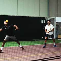 An intense moment during a doubles pickleball match. My courts provide the perfect setup for fast-paced rallies and strategic plays, making every game an adventure.