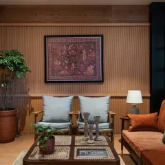 This cozy nook in the Primus sales lounge features our custom wooden armchairs with plush cushions. The warm wood tones and textured wall panels create a tranquil space that feels both sophisticated and comfortable.