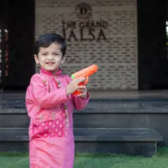 Even when dressed up, kids will be kids. I love capturing their playful personalities, creating a fun contrast between the formal attire and their candid actions.