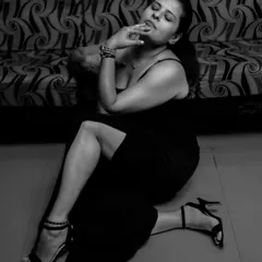 A moody, artistic shot from my 'Black Magic' series, featuring the black bodycon gown. Style is as much about attitude as it is about the clothes.