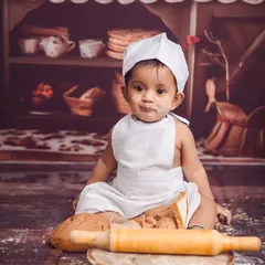 Our little baker is ready to get to work. This chef theme is so much fun, with a tiny apron, hat, and a set full of bread and baking tools.