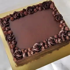 Sheet cakes are perfect for larger gatherings. This dark chocolate sheet cake is easy to cut and serve, and the piped rosettes add a touch of elegance.