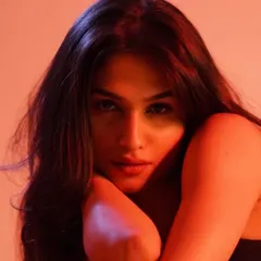 A fierce and moody portrait of model Kashish Kapoor. Using dramatic red lighting and minimal, clean makeup, I focused on enhancing her strong features to create a powerful and intense image.