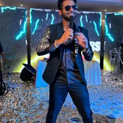 From grand stages to intimate celebrations, I bring the right vibe. Here I am, mid-performance at a sangeet, creating an unforgettable night for the happy couple and their guests.