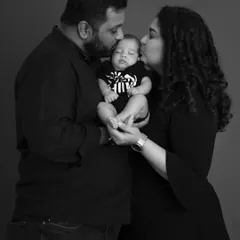 Your first portrait as a new family is a treasure. This classic black and white style focuses on the emotion and connection, creating a timeless image of the love that surrounds your new baby.
