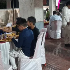 A closer look at the guest seating arrangement during an indoor party. We ensure that the tables and chairs are set up properly to allow for comfortable dining and easy movement.