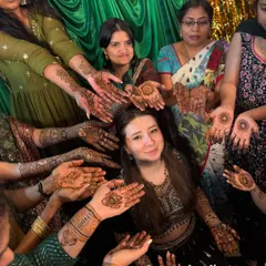 We love being part of such happy moments. Here, guests from an international wedding proudly display their unique henna designs, all done by our team.