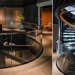 A closer look at the central staircase at BCG HQ, where glass, steel, and wood create a dynamic interplay of materials, connecting the different levels of the vertical campus.