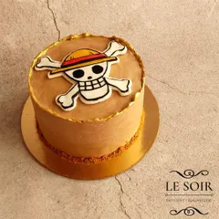 A simple yet striking One Piece cake. This half-kg Coffee Hazelnut cake has a mocha buttercream finish and is topped with the iconic Straw Hat Pirates Jolly Roger logo.