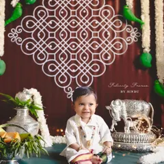 A happy smile for the festival of Ugadi. This little one is surrounded by traditional elements, celebrating new beginnings.
