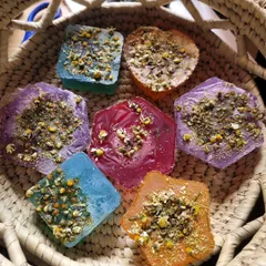 A closer look at my colorful collection of handmade Chamomile soaps. Each bar is infused with real herbs for a truly natural and aromatic cleansing experience that calms the skin.
