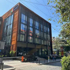 A duplicate image of the Sattva Auro commercial building on Church Street.