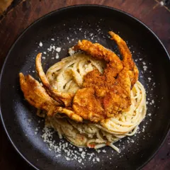 An Italian classic meets coastal indulgence. My Soft Shell Crab Aglio e Olio is a unique creation, with perfectly cooked spaghetti tossed in garlic and oil, topped with a crispy, flavorful crab.