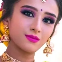A detailed view of a dramatic purple smokey eye paired with a bright pink lip. This look is perfect for clients who want bold, colorful makeup for their photoshoot.