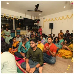 Our community sits together, absorbed in the devotional atmosphere of the Janmashtami celebration. It's a time for reflection, connection, and shared joy.