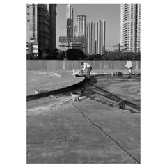 Our team at work on a vast podium, with the city skyline as our backdrop. This image captures the scale of our commercial landscape projects and our hands-on involvement in every stage of the civil work and construction.