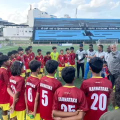 A key part of my service is communication. Here, I am talking with the youth team during a break, providing guidance on injury prevention and ensuring they are physically prepared for the game ahead.