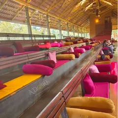 Colorful seating arrangements at the Panchavati Pavilion. We arranged vibrant cushions and bolsters to ensure guests are comfortable while watching the traditional wedding ceremonies.