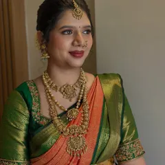 A three-quarter profile shot showcasing the bride's elegant makeup and hairstyle. The subtle contouring and highlighting enhance her features, creating a look that is perfect for wedding photography.