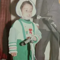 This is me as a child, already on stage. My grandfather always believed in my potential. This journey of public speaking started long ago and has defined who I am today.