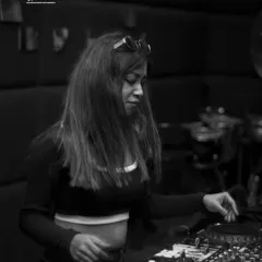 A black and white shot from the same private wedding party. It captures the intense, focused mood of a techno set.
