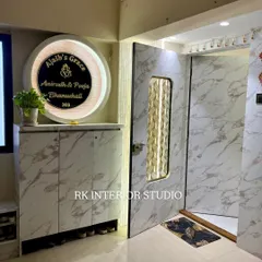 A grand entrance with a marble-finish door and a stunning backlit nameplate. The design includes a shoe rack with seating.