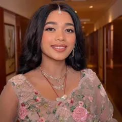 This is what I call effortless glow. The makeup is minimal yet impactful, with a focus on clean skin, soft pink tones, and a radiant finish that looks like it's lit from within.