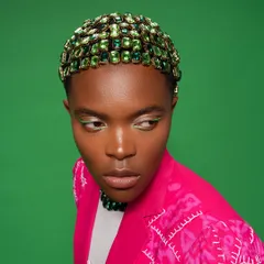 Hair can be the main event. For this look, I spent hours creating a custom headpiece by individually applying green gems to form a sparkling, textured cap. I paired it with a sharp, lime-green winged liner to tie the whole high-fashion concept together.