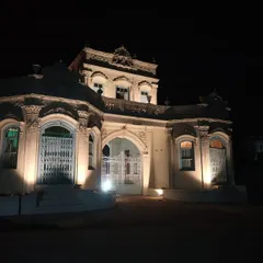The full facade of Rhodesia House lit against the night sky. Our lighting design was conceived to accentuate its stately presence and intricate details, transforming the historic structure into a landmark that is visible and celebrated day and night.