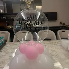It's all in the details. This personalized balloon centerpiece for a bridal shower adds a special touch to the table setting, welcoming guests to the celebration.