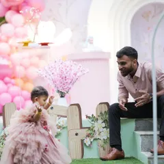 A sweet, candid moment between a father and his daughter at her enchanted fairy garden-themed birthday party. These are the precious memories we love to help create.
